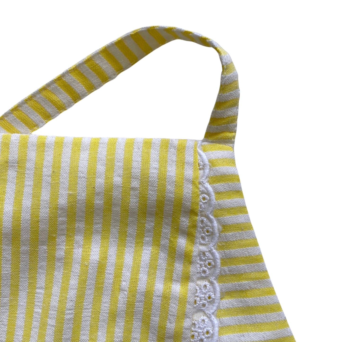 Yellow and white striped apron top with lace trim on a white background