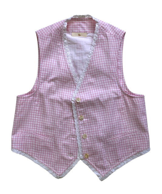 Pink checkered vest with lace trim on a white background