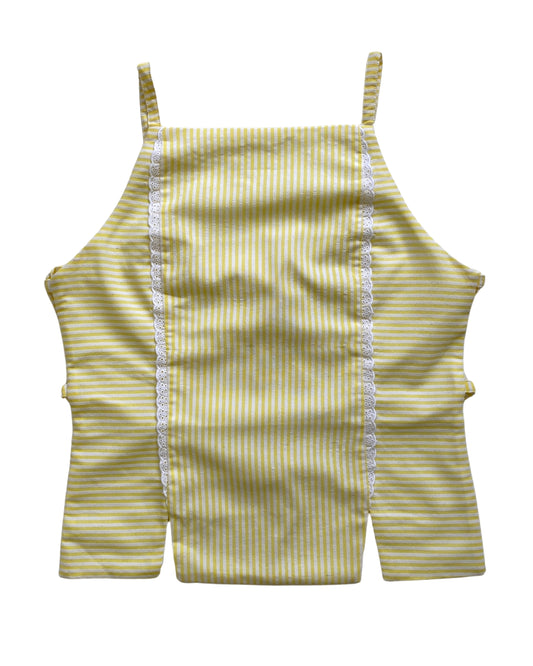 Yellow and white striped tank top with thin straps on a white background