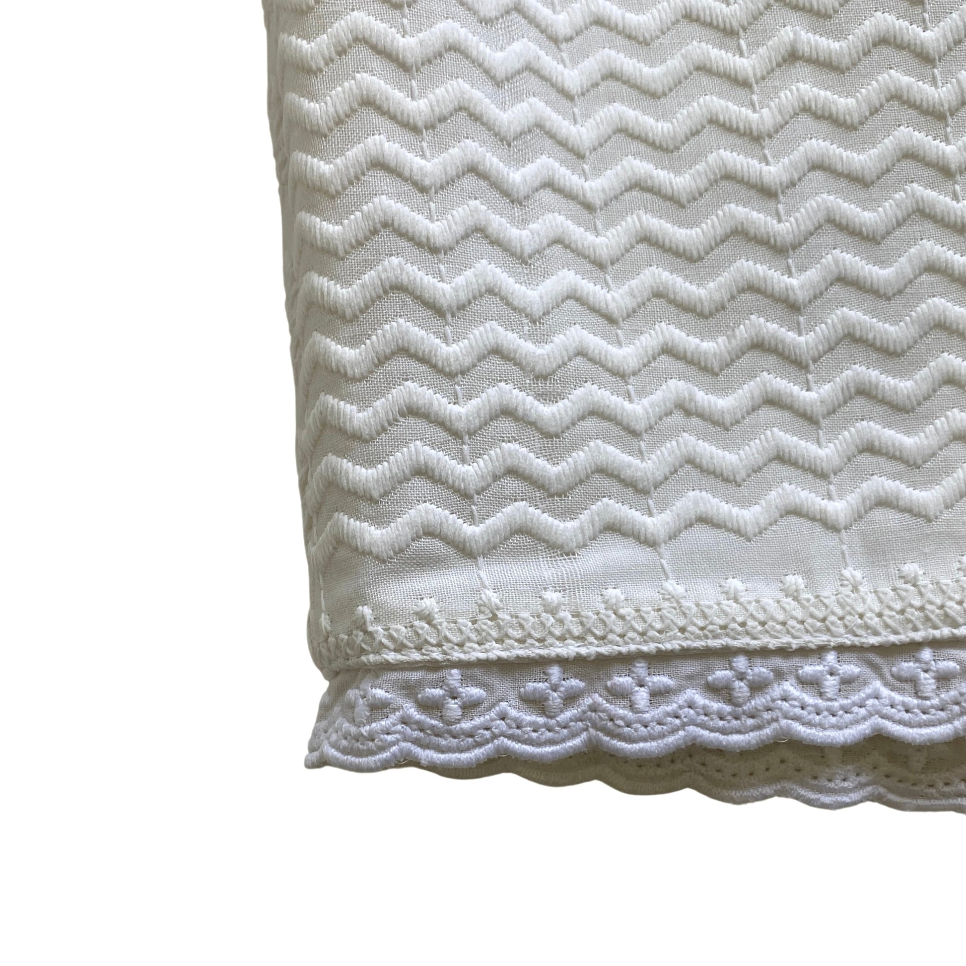 White corset with zigzag pattern on a white background