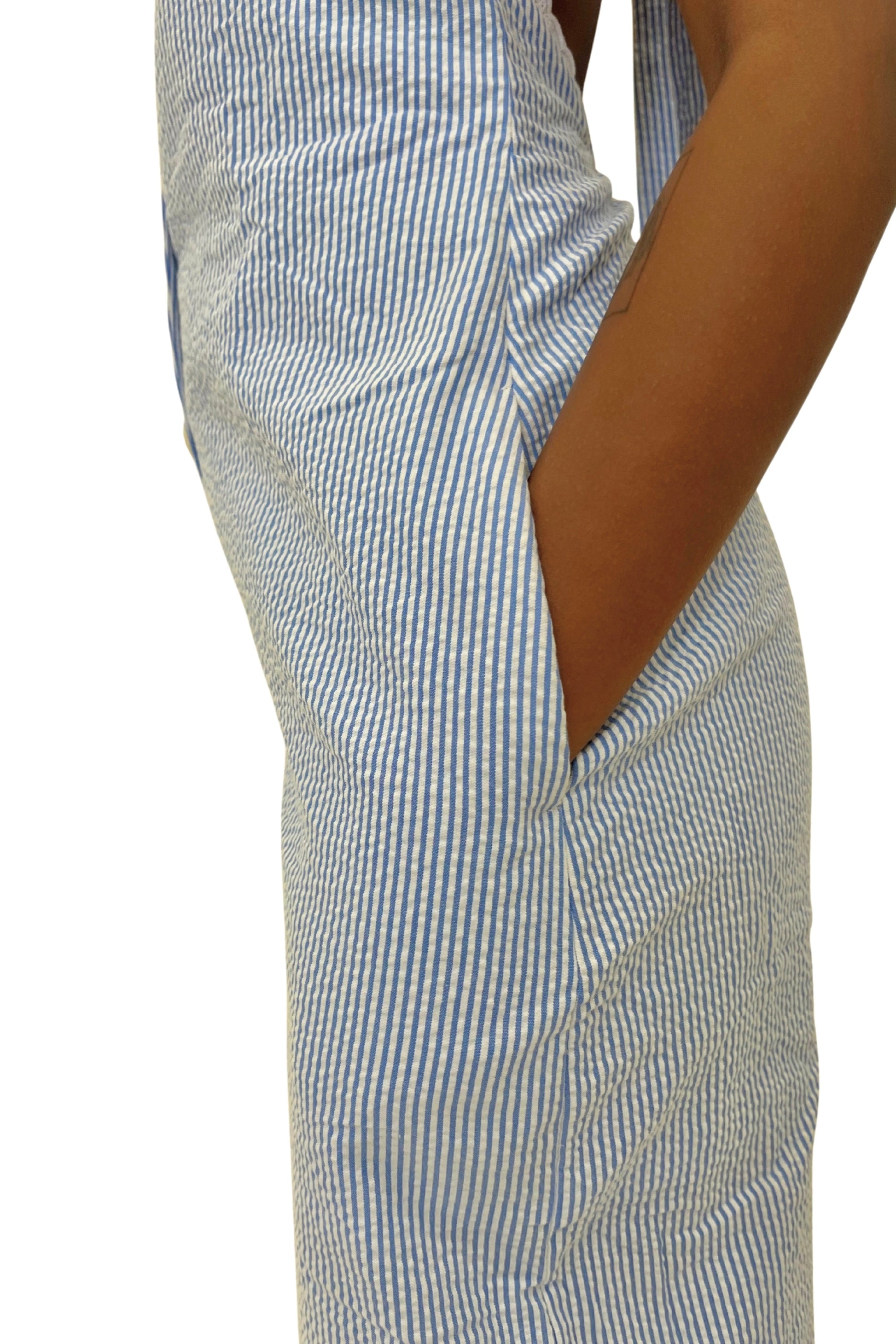 Blue and white striped jumpsuit worn by a model