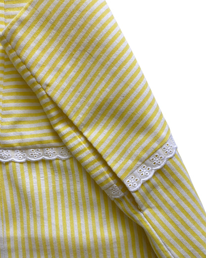Yellow and white striped skirt with lace trim on a white background