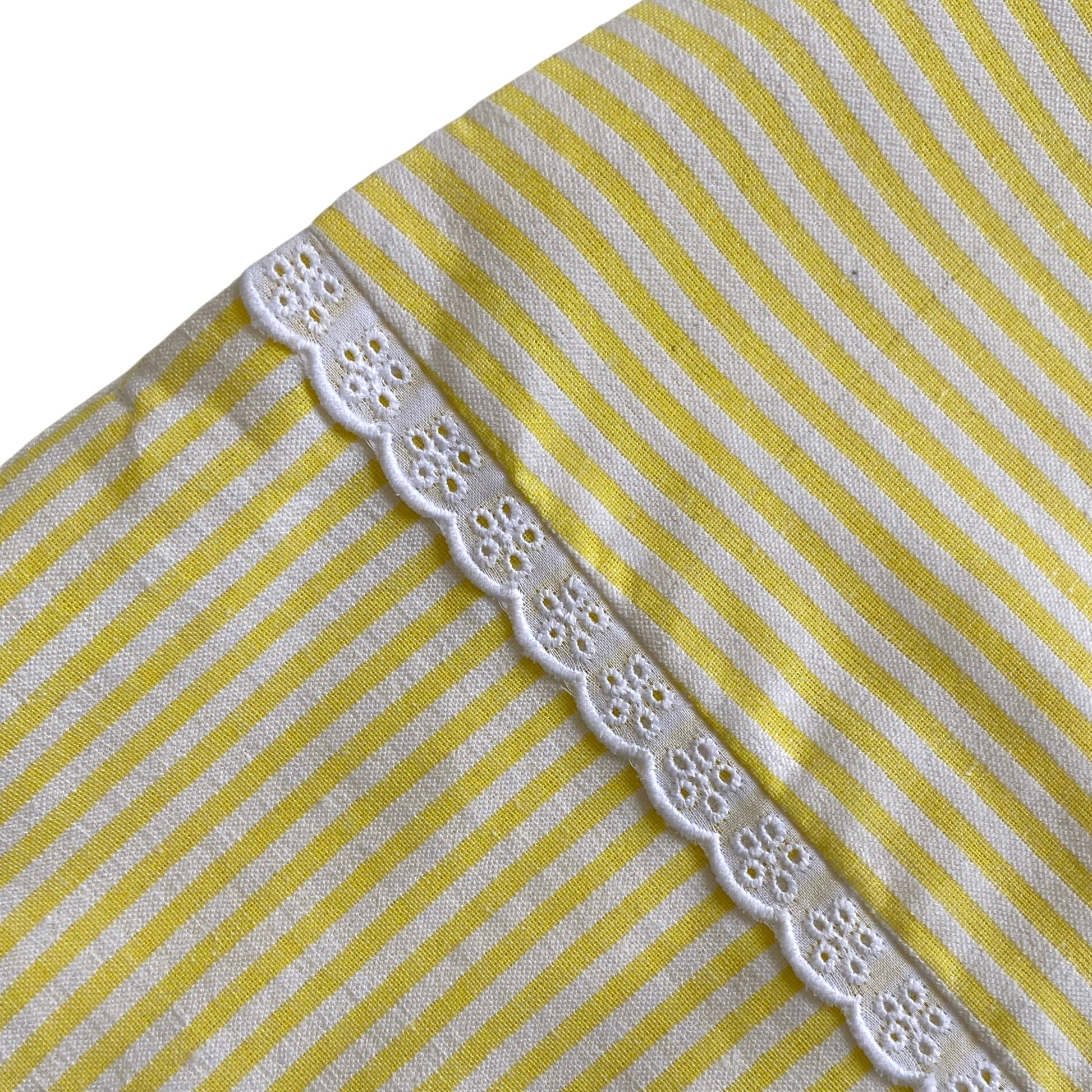 Yellow and white striped fabric seersucker skirt with lace trim.
